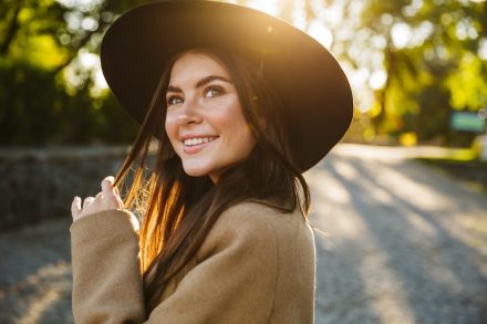 image-of-attractive-woman-smiling-while-walking-in-HXMXYX9